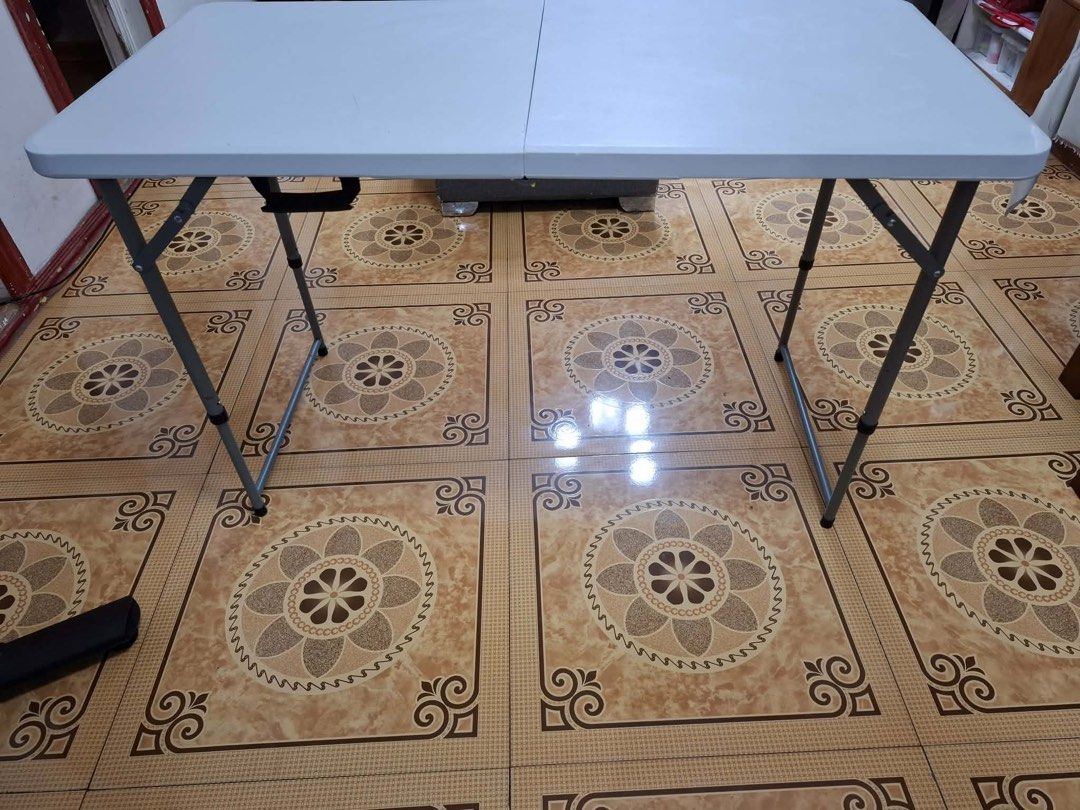 White Folding Table with Metal Legs (Category: Tables & Sets) located in Manila. Submitted by 9bqndkbtx210166 (Listing ID 1456040086, Image 3). Description: - White folding table - Durable plastic top - Sturdy metal legs that fold for easy storage - Approximately 4 feet long - Ideal for events, parties, or as an extra workspace - Ready for pickup.