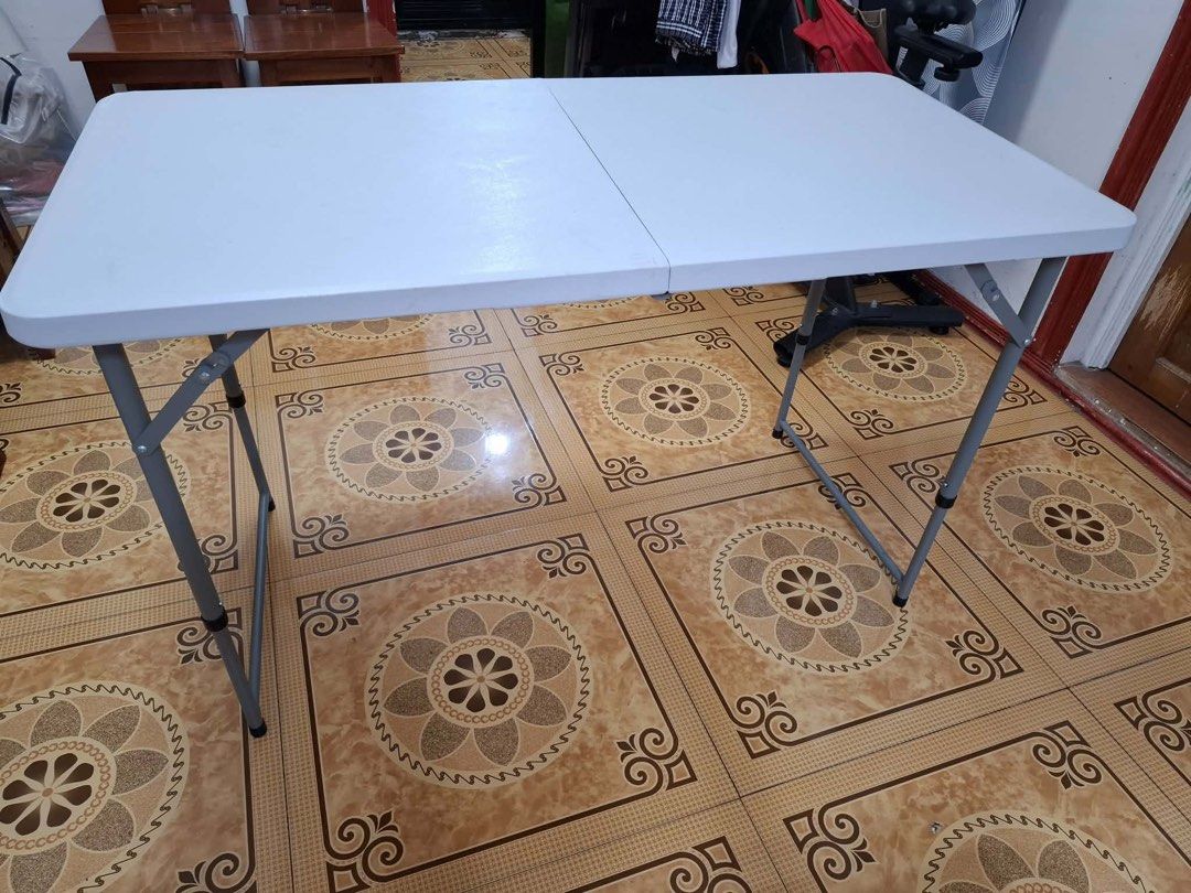 White Folding Table with Metal Legs (Category: Tables & Sets) located in Manila. Submitted by 9bqndkbtx210166 (Listing ID 1456040086, Image 2). Description: - White folding table - Durable plastic top - Sturdy metal legs that fold for easy storage - Approximately 4 feet long - Ideal for events, parties, or as an extra workspace - Ready for pickup.