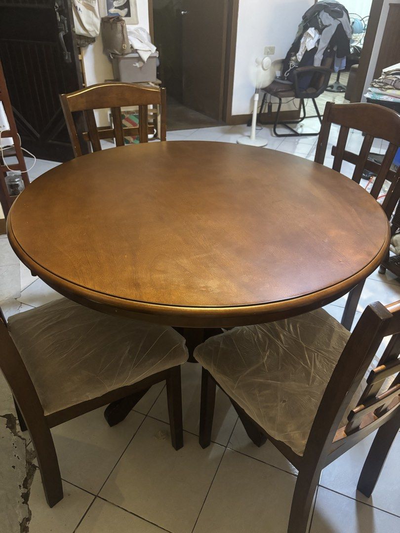 Wooden Round Dining Table with 4 Chairs (Category: Tables & Sets) located in Pasig City. Submitted by lhengay (Listing ID 1455982226, Image 2). Description: - Round wooden dining table - Includes 4 matching chairs - Sturdy pedestal base for the table - Cushioned seats on chairs for comfort - Ideal for small to medium dining spaces - Ready for a new home - Pickup only Moving out sale.. malaki sya para sa lilipatan namin..Halos bago pa po talaga ki