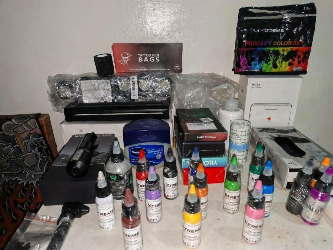 Xtreme Tattoo Ink Set & Wireless Pen Kit (Category: Craft Supplies & Tools) located in Quezon City. Submitted by yours1 (Listing ID 1455874147, Image 2). Description: - Complete Tattoo Supply Bundle - Includes Xtreme Primary Color Ink Set - Wireless Tattoo Pen - Additional Ink Bottles: Brown, Purple, Yellow, Orange, Green, Blue, Pink - Tattoo Pen Bags - Grip Tape - Vaseline - Perfect for Aspiring Tattoo Artists or Personal Use - All items shown i