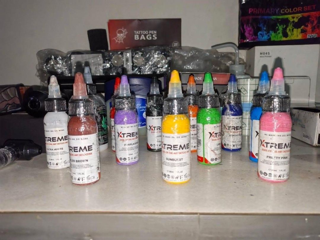 Xtreme Tattoo Ink Set & Wireless Pen Kit (Category: Craft Supplies & Tools) located in Quezon City. Submitted by yours1 (Listing ID 1455874147, Image 3). Description: - Complete Tattoo Supply Bundle - Includes Xtreme Primary Color Ink Set - Wireless Tattoo Pen - Additional Ink Bottles: Brown, Purple, Yellow, Orange, Green, Blue, Pink - Tattoo Pen Bags - Grip Tape - Vaseline - Perfect for Aspiring Tattoo Artists or Personal Use - All items shown i