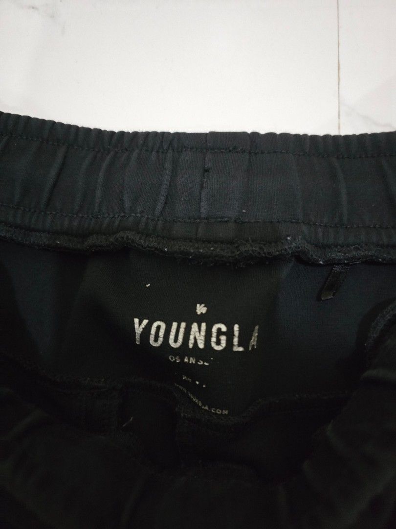 YOUNGLA Joggers Black Size Medium 30-34x35.5L (Category: Joggers) located in La Trinidad. Submitted by odin21 (Listing ID 1455873860, Image 2). Description: - Black YOUNGLA joggers - Size: Medium (fits waist 30-34 inches) - Length: 35.5 inches - Elastic waistband with drawstring - Stylish side stripe detail - Convenient pockets: 2 side, 1 back - Perfect for comfortable everyday wear.
