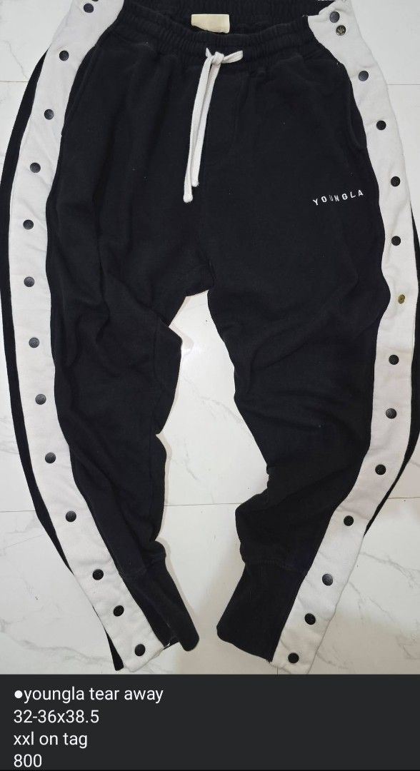 YOUNGLA Tear Away Snap Button Track Pants (Category: Joggers) located in La Trinidad. Submitted by odin21 (Listing ID 1455874069, Image 1). Description: - Brand: YOUNGLA - Style: Tear Away Pants - Color: Black - Features: White snap buttons down sides, elastic waistband with drawstring - Size: XXL (fits waist 32-36 inches) - Length: 38.5 inches - Ideal for: Casual wear, sports.