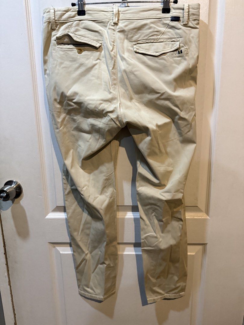 Zara Men Khaki Pants Jeans (Category: Jeans) located in Makati City. Submitted by johnf02 (Listing ID 1455982581, Image 2). Description: • Size: EU 42 • Price: Php 590 • Bought in Zara Barcelona • Slight stitching concern, but it can be altered • Buy 2 items from my listings, get a discount • Sold on an as is, where is basis • Payment via GCash/Maya/BPI/BDO/Unionbank/GoTyme • Shipping to be shouldered by the buyer Comfy green parachute pants from