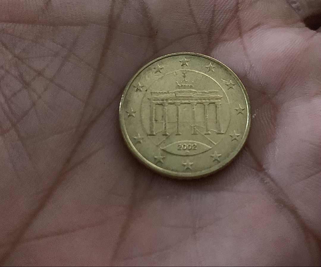 50 Euro Cent Coin - Germany 2002 (Category: Currency) located in Zamboanga. Submitted by dayangjail94920 (Listing ID 1456063188, Image 2). Description: - Authentic 50 Euro Cent coin from Germany - Year: 2002 - Features the iconic Brandenburg Gate - Ideal for coin collectors - Makes a unique souvenir - Own a piece of European currency.