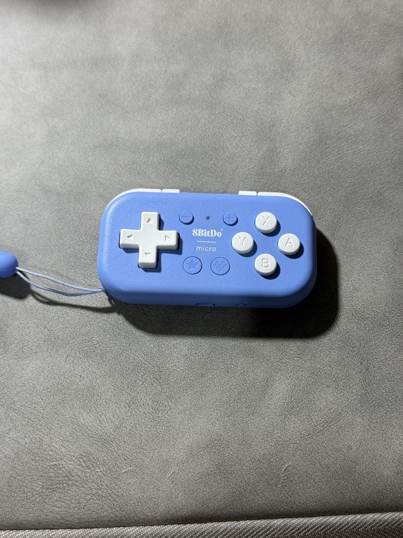 8BitDo Micro Bluetooth Gamepad Controller Light Blue (Category: Controllers) located in Manila. Submitted by ellalei (Listing ID 1456097833, Image 2). Description: - Light blue 8BitDo Micro Bluetooth gamepad - D-pad, A, B, X, Y buttons - L1, L2, R1, R2 shoulder buttons - USB-C charging port - Includes wrist strap - Compatible with various devices - No box - RFS: Only used for boards / anki review :) .