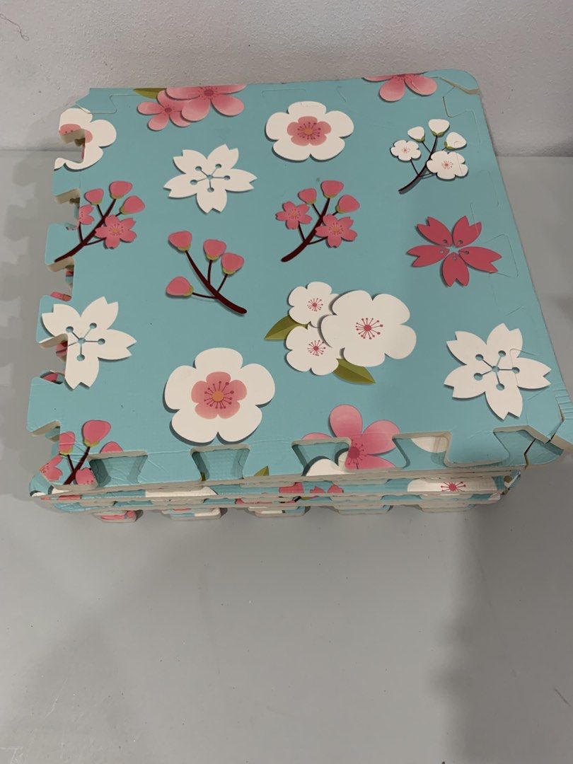 9 pcs puzzle Floral Foam Play Mat (Category: Infant Playtime) located in Pasig City. Submitted by tinylittlestore (Listing ID 1456224136, Image 3). Description: - 9 pcs - Cute floral design: Light blue with pink and white flowers. - Soft & safe: Provides a cushioned surface for play. - Easy assembly: Interlocking foam tiles snap together quickly. - Versatile: Ideal for nurseries, playrooms, or any play area. - Convenient: Simple to assemble and d