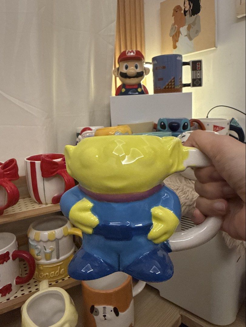 Alien Toy Story Ceramic Mug (Category: Coffee & Tea Tableware) located in Pasig City. Submitted by shallystoyhub (Listing ID 1456202724, Image 1). Description: Toy Story Alien Mug - Bright yellow alien with blue uniform. Perfect for coffee/tea, fans, and kitchen decor..