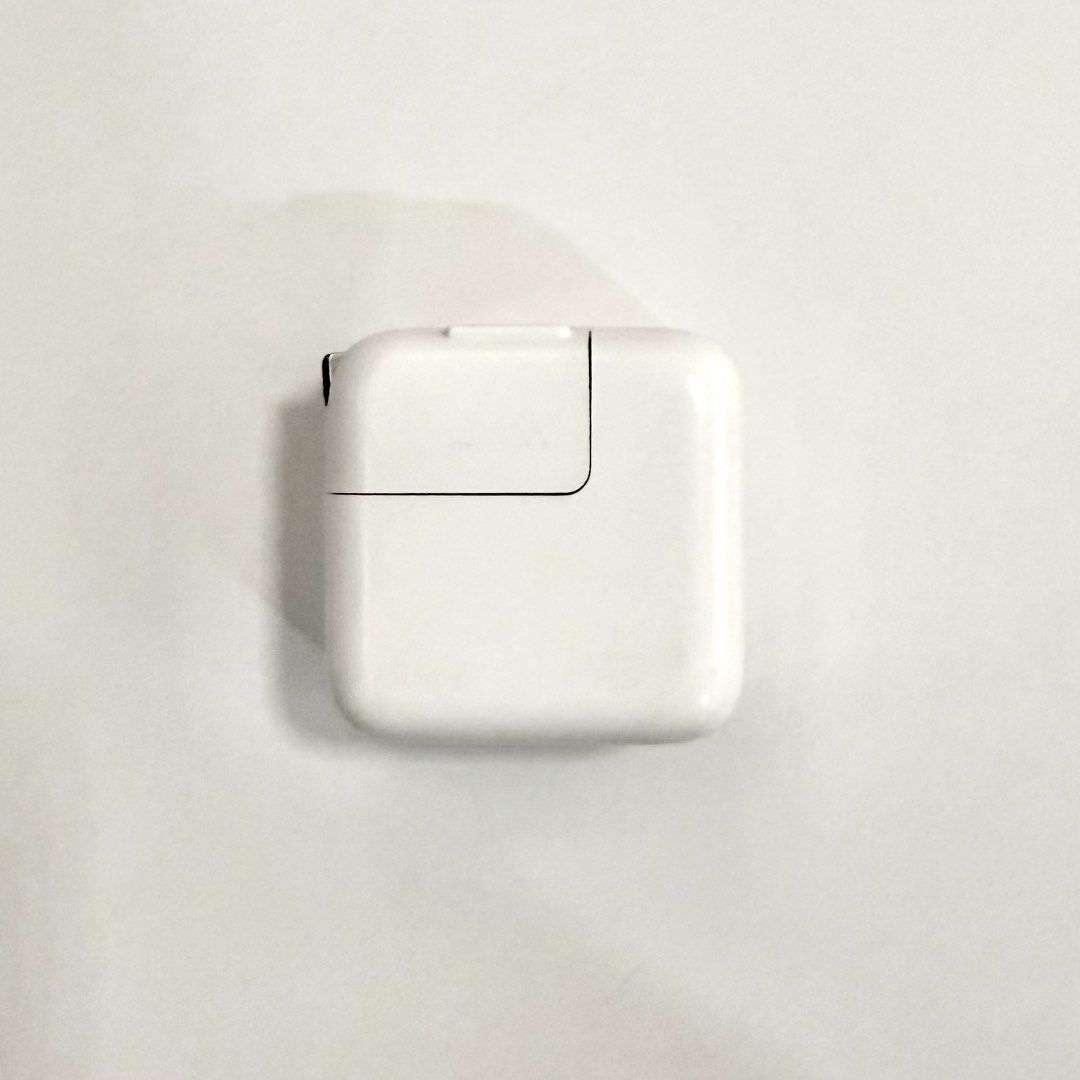 Apple 10W USB-A wall charger / power adapter (Category: Cables & Adaptors) located in Quezon City. Submitted by aj.mnl (Listing ID 1456165364, Image 1). Description: Original Apple charger.