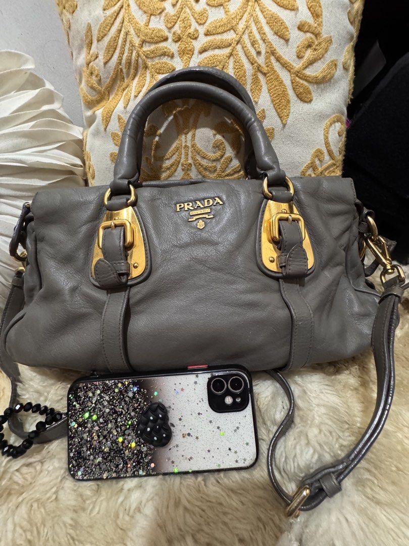 Authentic leather Prada bag in gray. (Category: Luxury Bags & Wallets) located in San Pablo. Submitted by docannie3869170 (Listing ID 1456074062, Image 1). Description: My personal bag. Very luxurious kahit gusot. Gold na gold hardwares. Pangharabas din for sure hindi ka maslashan sa kapal ng leather. Buyer will shoulder SF. .