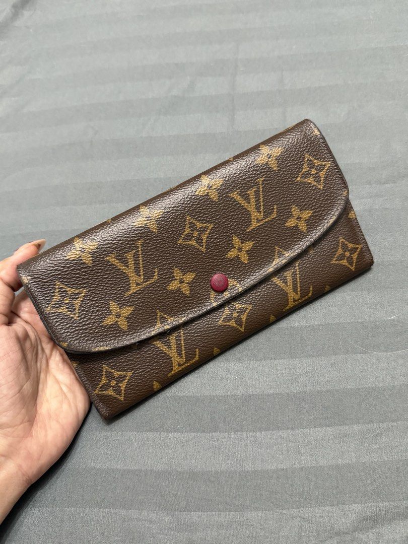 Authentic LV Louis Vuitton Monogram Emilie Long Wallet w receipt (Category: Luxury Bags & Wallets) located in Taytay. Submitted by mipreluxe2 (Listing ID 1456079478, Image 1). Description: Authentic LV Louis Vuitton Monogram Emilie Long Wallet - Fuchsia Comes with receipt In great condition Guaranteed authentic 💯 10x Moneyback if proven fake Normal signs of usage, refer to the photos Message me if you want additional photos. No inclusions BDO, G