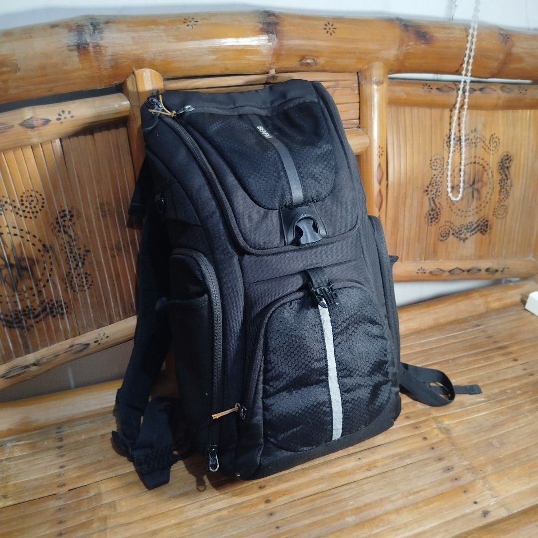 BENRO Coolwalker CW200LG DSLR CSC Camera Backpack (Category: Camera Bags & Carriers) located in Caloocan City. Submitted by cachero_kai (Listing ID 1456089838, Image 1). Description: - Black BENRO camera backpack - Multiple padded compartments for camera and lenses - Front pocket for smaller items - Side pockets for accessories - Includes a rain cover - Great for photographers on the go.