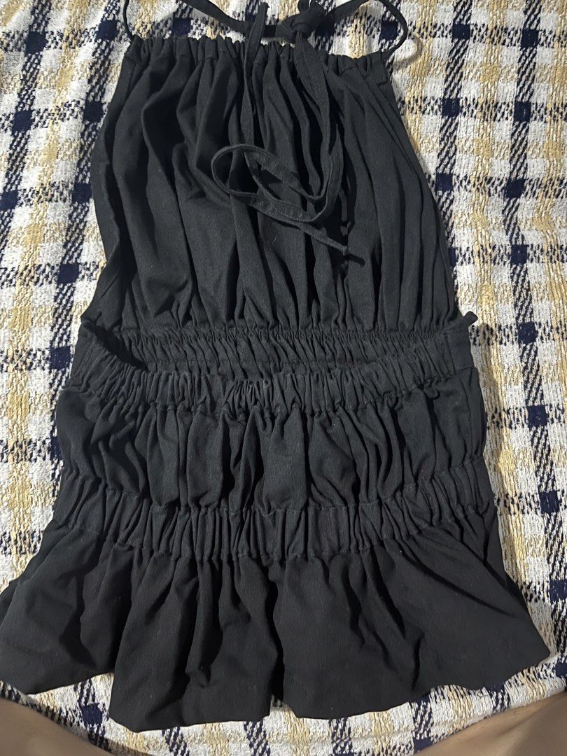 Black Ruched Halter Neck Peplum Top (Category: Sleeveless) located in Botolan. Submitted by arrietafrancinealexis (Listing ID 1456107634, Image 2). Description: - Black halter neck top - Ruched detailing - Cinched waist - Peplum hem - Ties at the back of the neck - Versatile for night out or casual wear - Easy to pair with jeans or skirts - Comfortable fabric.