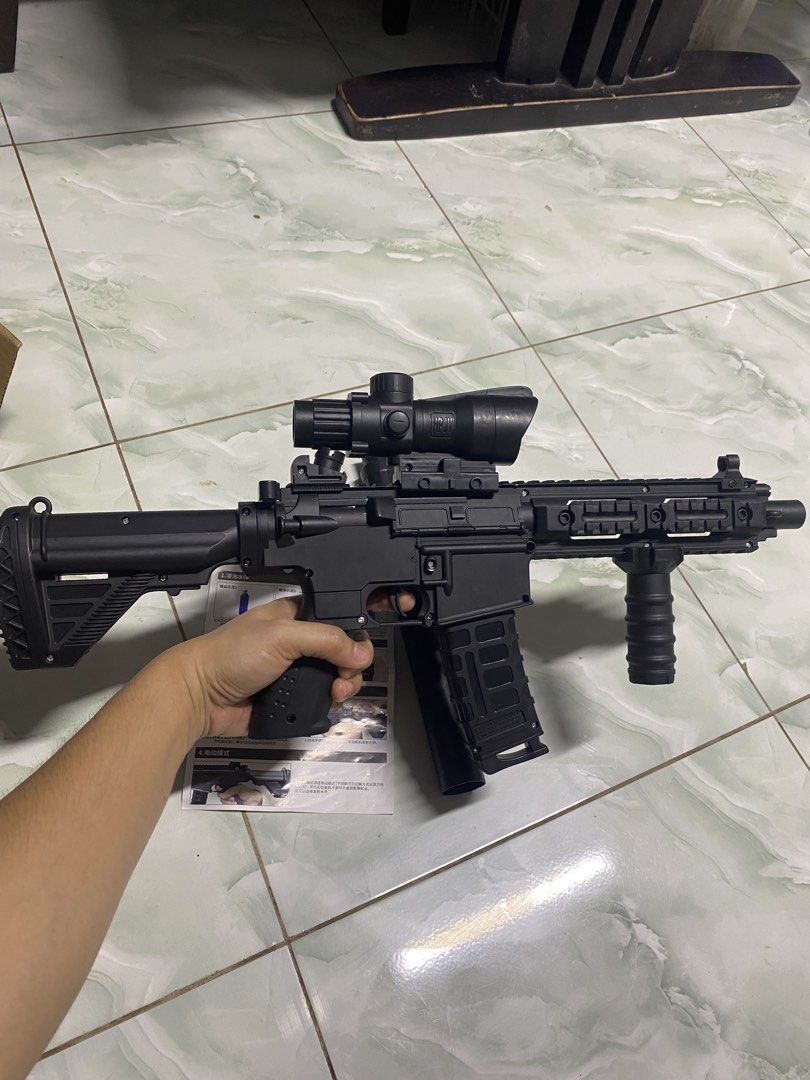 Black Toy Rifle with Scope and Silencer (Category: Action & Battle Toys) located in Pasacao. Submitted by wengpullar37205 (Listing ID 1456216256, Image 3). Description: - Black toy rifle with scope and silencer attachment - Made of plastic - Comes with assembly and use instructions - Great for play or display - Original box included, shows some wear - Selling as is.