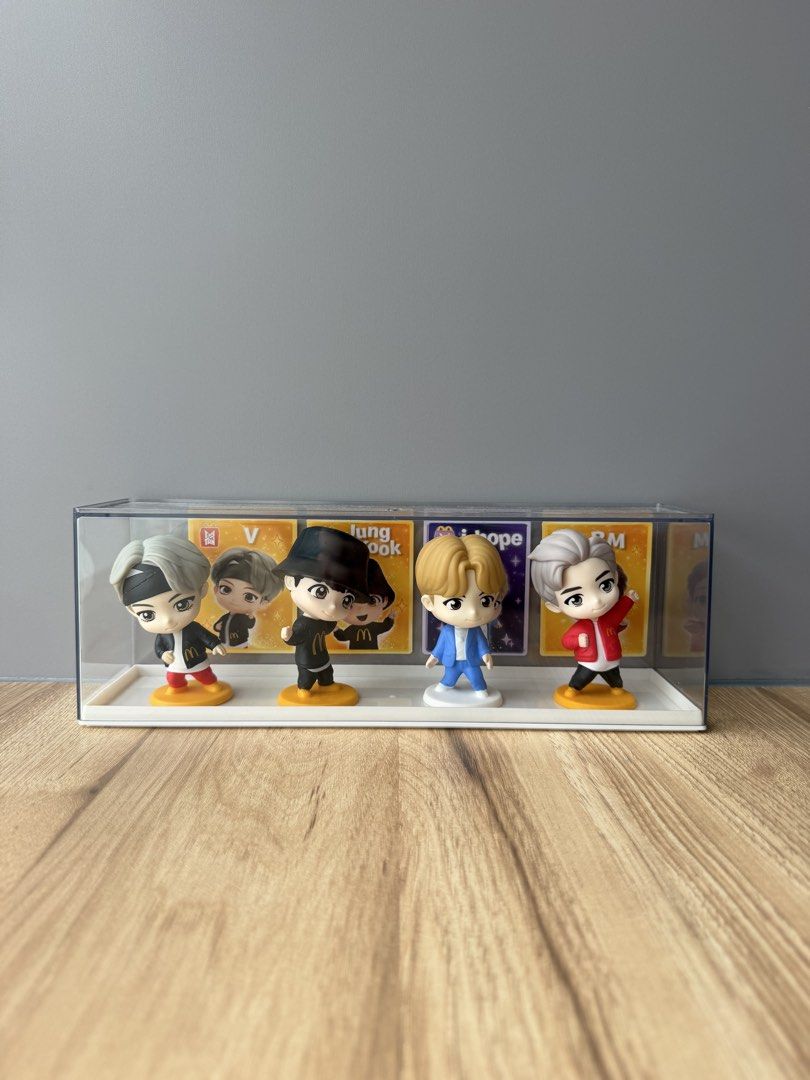 BTS McDonald's Collection Figurines Display Case (Category: Figurines & Statues) located in Pasay City. Submitted by wontonwonie (Listing ID 1456129300, Image 1). Description: - Set of 4 BTS McDonald's collaboration figurines - Features members in iconic outfits - Includes a clear display case - Super cute and detailed design - A must-have for any BTS fan's collection!.