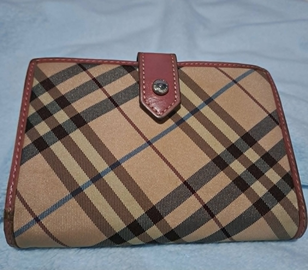 Burberry Blue Label Nova Check Wallet (Category: Luxury Bags & Wallets) located in Pila. Submitted by ester_aurea (Listing ID 1456216501, Image 2). Description: Preloved and well used Authentic Fixed price 850.00 plus J&T SF Gcash Payment No cod - Authentic Burberry Blue Label wallet - Classic Nova Check pattern - Pink leather trim and interior - Secure snap closure - Ample card slots and bill compartment - Approximate dimensions: 7.5 inches x 4 