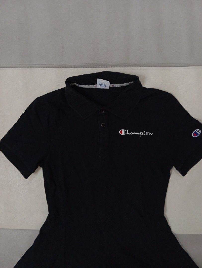 Champion Black Polo Dress (Category: Dresses) located in Quezon City. Submitted by babybubots (Listing ID 1456067394, Image 2). Description: - Champion Polo Shirt - Size: Medium - Color: Black - Features: Classic collar, button placket, embroidered Champion logo on chest and sleeve - Style: Comfortable and casual MOP: Maya, Gcash or RCBC MOD: Lalamove, Grab or Gogo Express Shipping from: Batasan Hills, QC.