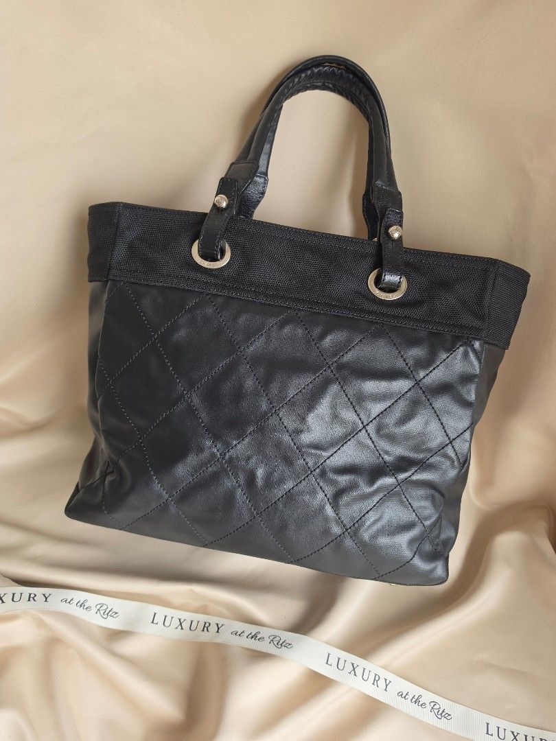 Chanel Tote (Category: Luxury Bags & Wallets) located in Makati City. Submitted by luxritz (Listing ID 1456066285, Image 2). Description: - Authentic black Chanel tote bag - Elegant quilted detailing - Comfortable leather handles - Iconic Chanel logo charm included - Crafted from a durable blend of leather and fabric and canvas - Ideal for everyday style and practicality Comes with sticker.