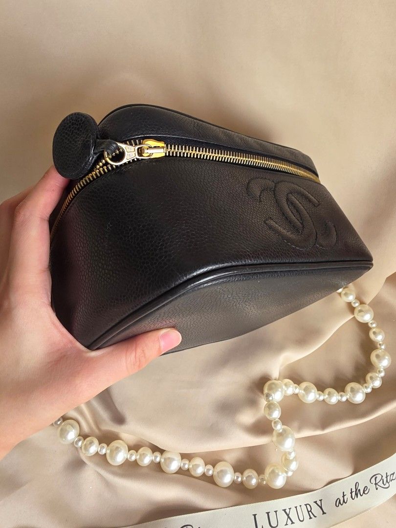 Chanel Black Caviar Vanity Case Bag with Pearl Strap (Category: Luxury Bags & Wallets) located in Makati City. Submitted by luxritz (Listing ID 1456065957, Image 3). Description: - Classic Chanel black caviar leather vanity case - Iconic embossed CC logo on the front - Comes with a beautiful pearl strap - Includes a silk scarf tied to the handle - Gold tone zipper closure - Perfect for a night out or as a statement piece Comes with Card and Box. 
