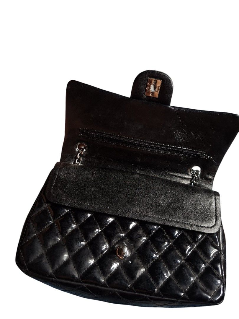 Chanel Kili/ Sling Bag Two Way (Category: Luxury Bags & Wallets) located in San Juan (Cabalian). Submitted by ec8thrift (Listing ID 1456101297, Image 2). Description: - Classic Chanel flap bag Chanel Kili/ Sling Bag Two Way - Black patent leather with quilted design - Silver chain strap - Iconic CC turn-lock closure - Interior zip pocket and main compartment - Versatile for day or night use.
