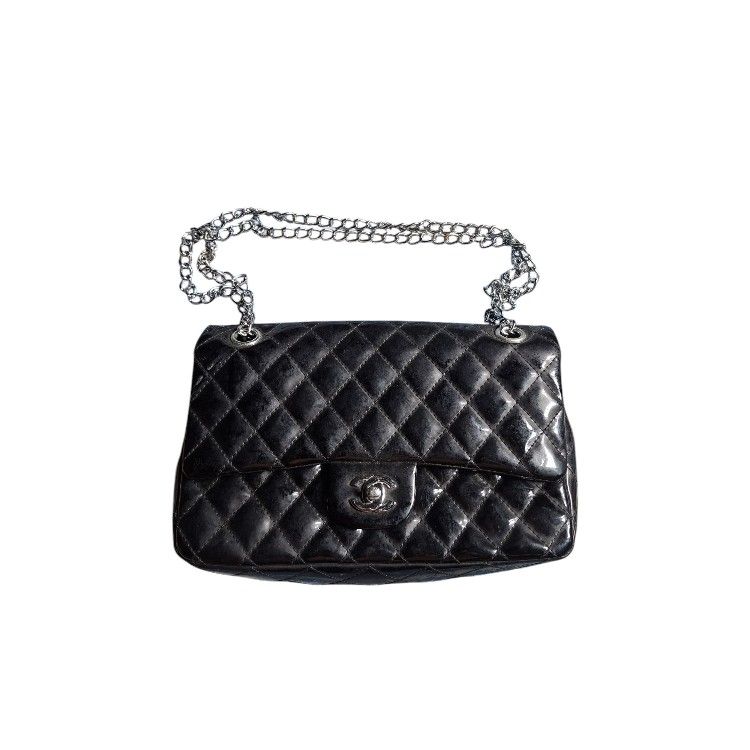 Chanel Kili/ Sling Bag Two Way (Category: Luxury Bags & Wallets) located in Leyte. Submitted by jpsrvd19 (Listing ID 1456101440, Image 1). Description: - Classic Chanel flap bag Chanel Kili/ Sling Bag Two Way - Black patent leather with quilted design - Silver chain strap - Interior zip pocket - Front turn-lock closure - Back slip pocket - Versatile for day or night use.