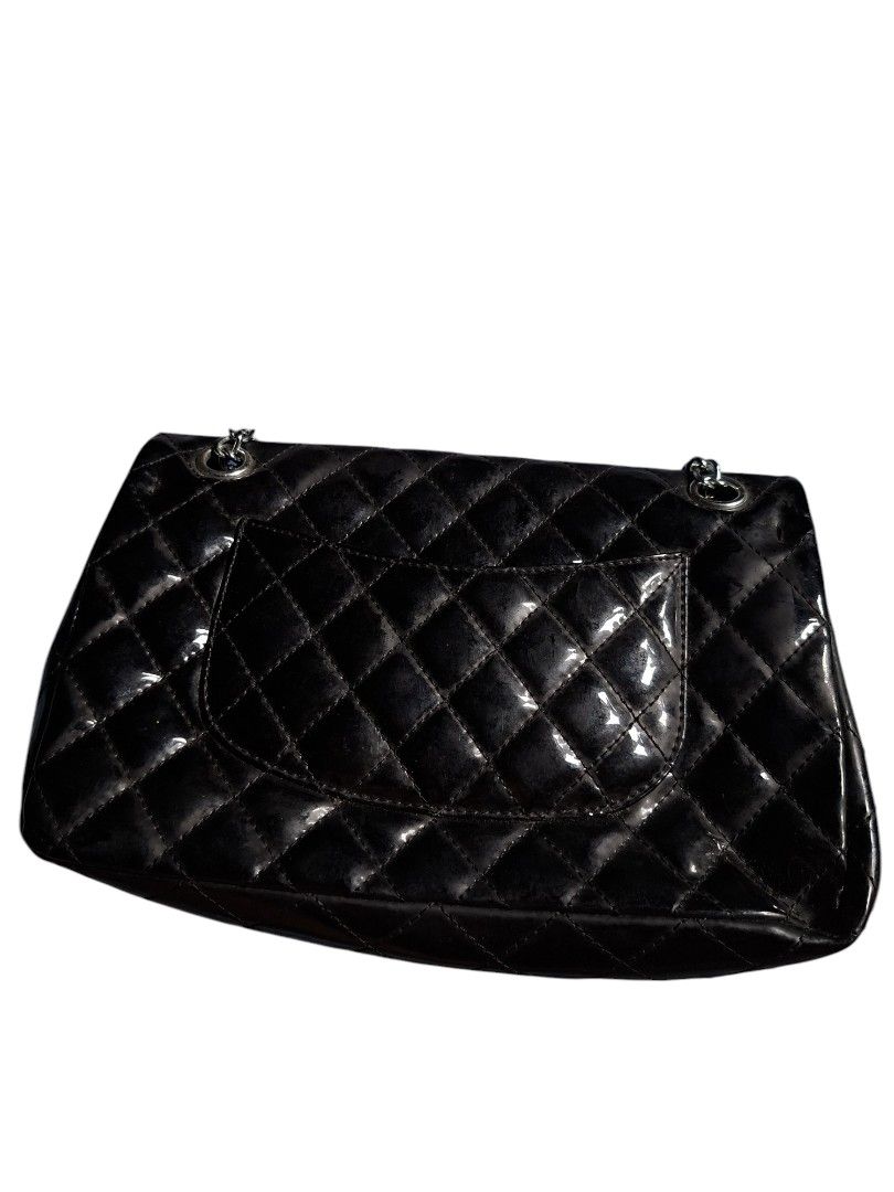 Chanel Kili/ Sling Bag Two Way (Category: Luxury Bags & Wallets) located in Leyte. Submitted by jpsrvd19 (Listing ID 1456101440, Image 3). Description: - Classic Chanel flap bag Chanel Kili/ Sling Bag Two Way - Black patent leather with quilted design - Silver chain strap - Interior zip pocket - Front turn-lock closure - Back slip pocket - Versatile for day or night use.