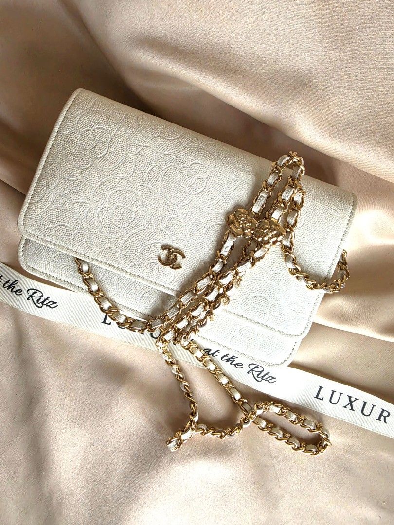 Chanel WOC (Category: Luxury Bags & Wallets) located in Makati City. Submitted by luxritz (Listing ID 1453910904, Image 2). Description: - Authentic Chanel Caviar WOC - Features embossed camellia pattern all over - Elegant gold hardware - Versatile leather and chain strap - Comes with full set (box, dustbag, authenticity card, etc.) - Brand new, unused condition.