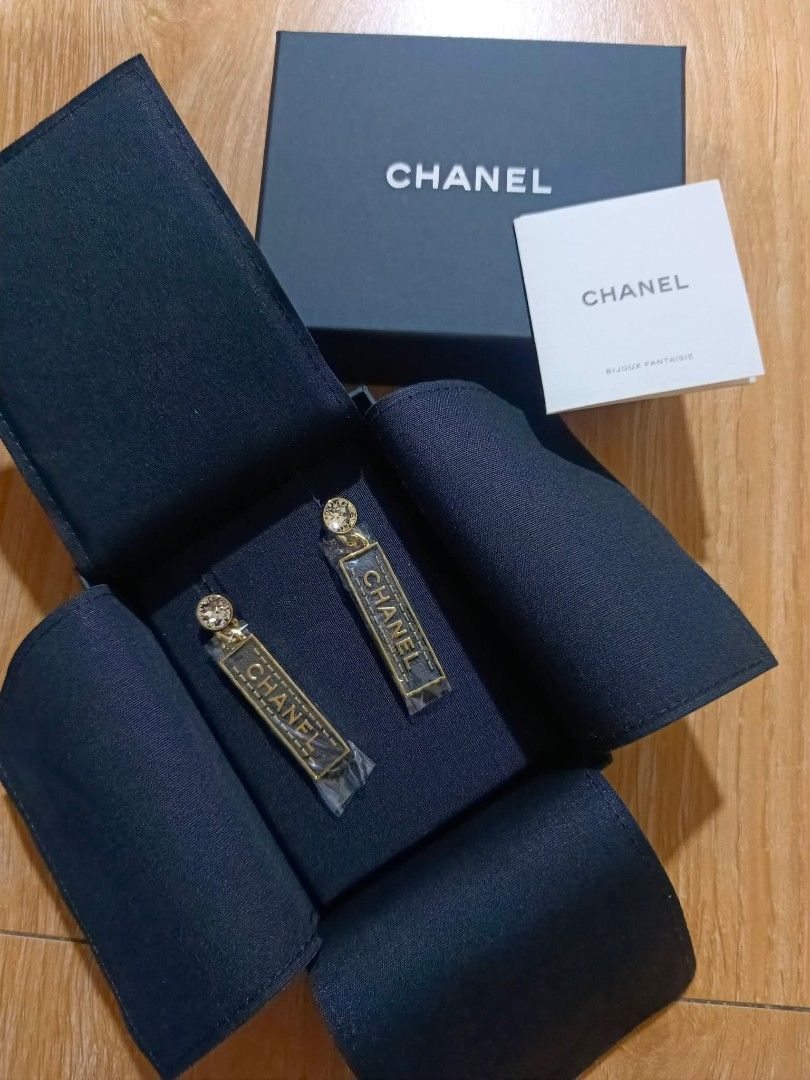 Chanel Drop Earrings with Crystal Detail (Category: Luxury Accessories) located in Quezon City. Submitted by melmgpy (Listing ID 1456067592, Image 2). Description: - Authentic Chanel earrings - Includes original box - Gold tone hardware with clear crystal stud - Iconic Chanel logo and name - Perfect statement piece for a touch of luxury.