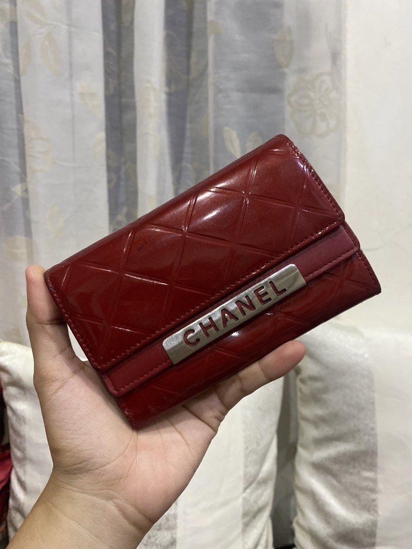 Chanel Red Patent Leather Quilted Wallet (Category: Luxury Bags & Wallets) located in Cadiz. Submitted by saveandstyleph (Listing ID 1456226124, Image 2). Description: Red Chanel Wallet - Material: Patent Leather - Design: Classic Quilted Pattern - Hardware: Iconic Chanel Logo - Style: Tri-fold - Interior: Plenty of space for cards and cash - Versatile: Ideal for everyday use or special occasions - A stylish and elegant accessory.