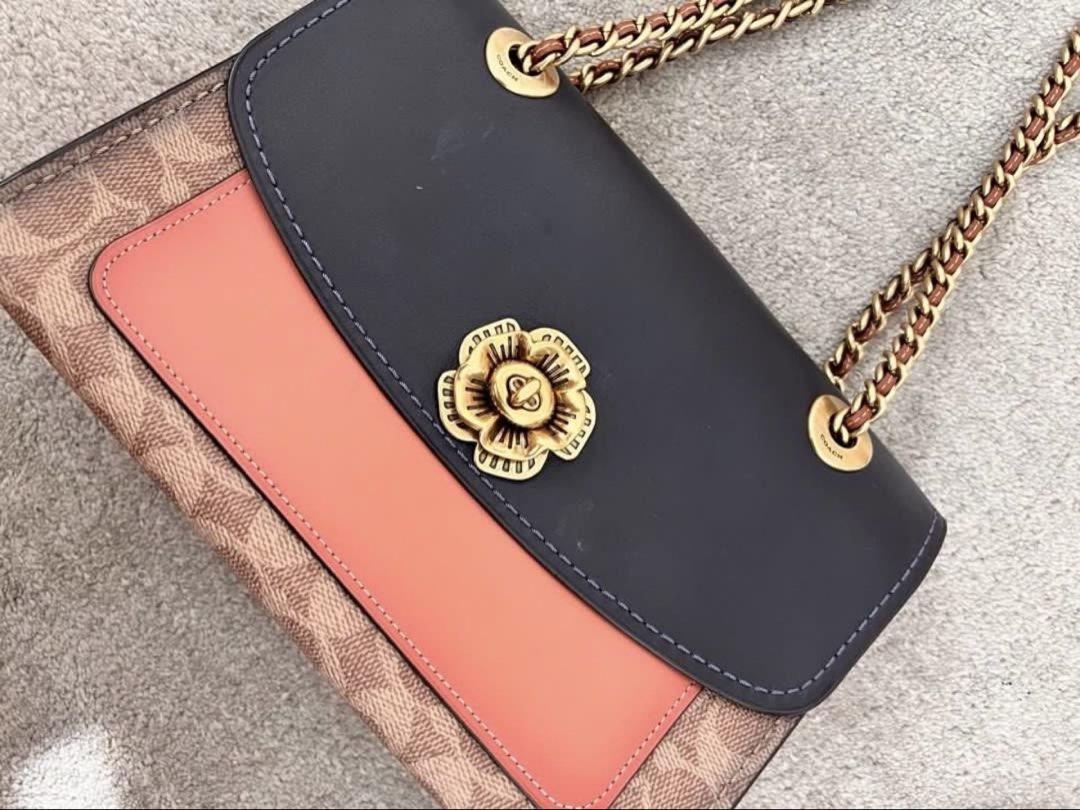 Coach chain bag shoulder or crossbody (Category: Luxury Bags & Wallets) located in Makati City. Submitted by nmvs1 (Listing ID 1456152865, Image 2). Description: Coach chain strap shoulder or cross body bag Leather and coated canvass monogram cc logo with gold hardware Chain strap can be longer made into a body bag With dustbag Used once excellent condition No flaw to mention bought for 25k in Coach Rockwell.