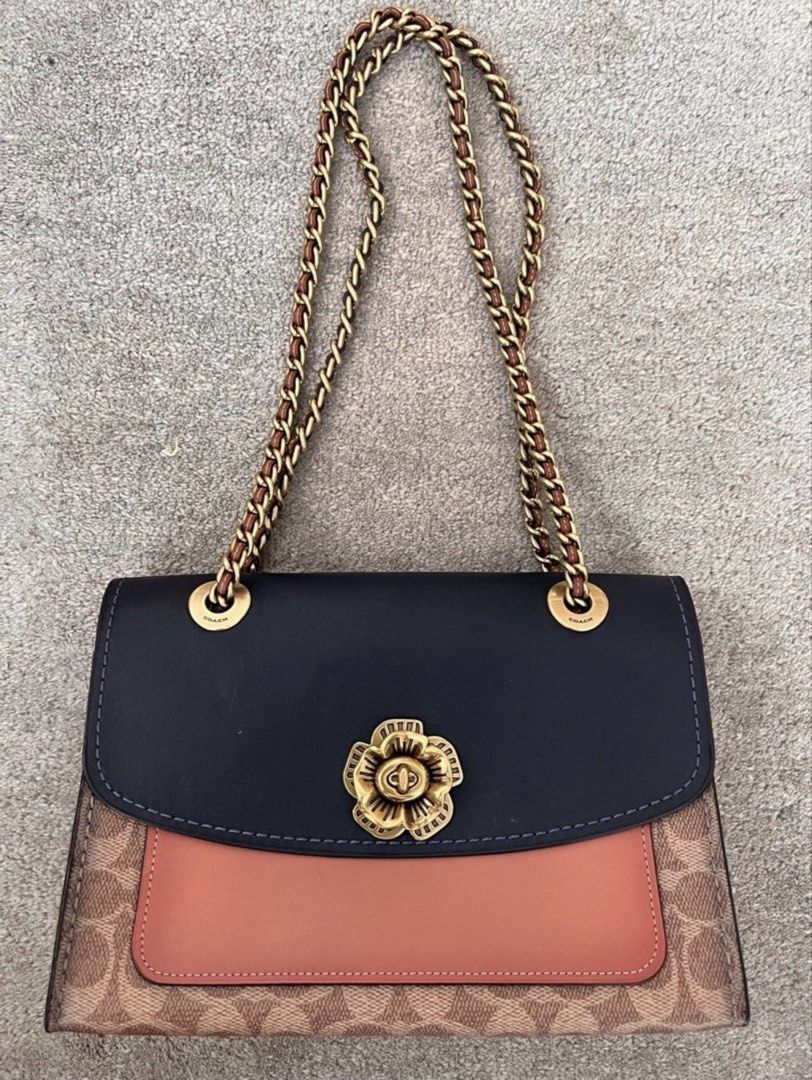 Coach chain bag shoulder or crossbody (Category: Luxury Bags & Wallets) located in Makati City. Submitted by nmvs1 (Listing ID 1456152865, Image 1). Description: Coach chain strap shoulder or cross body bag Leather and coated canvass monogram cc logo with gold hardware Chain strap can be longer made into a body bag With dustbag Used once excellent condition No flaw to mention bought for 25k in Coach Rockwell.