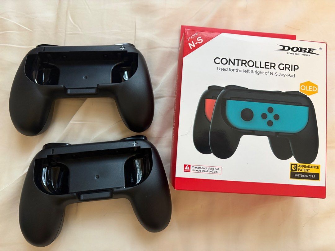 DOBE Controller Grip for Switch Oled (Category: Controllers) located in Singapore. Submitted by mosdef1 (Listing ID 1456075724, Image 1). Description: - DOBE Controller Grip for Nintendo Switch Oled - slight tear on box .