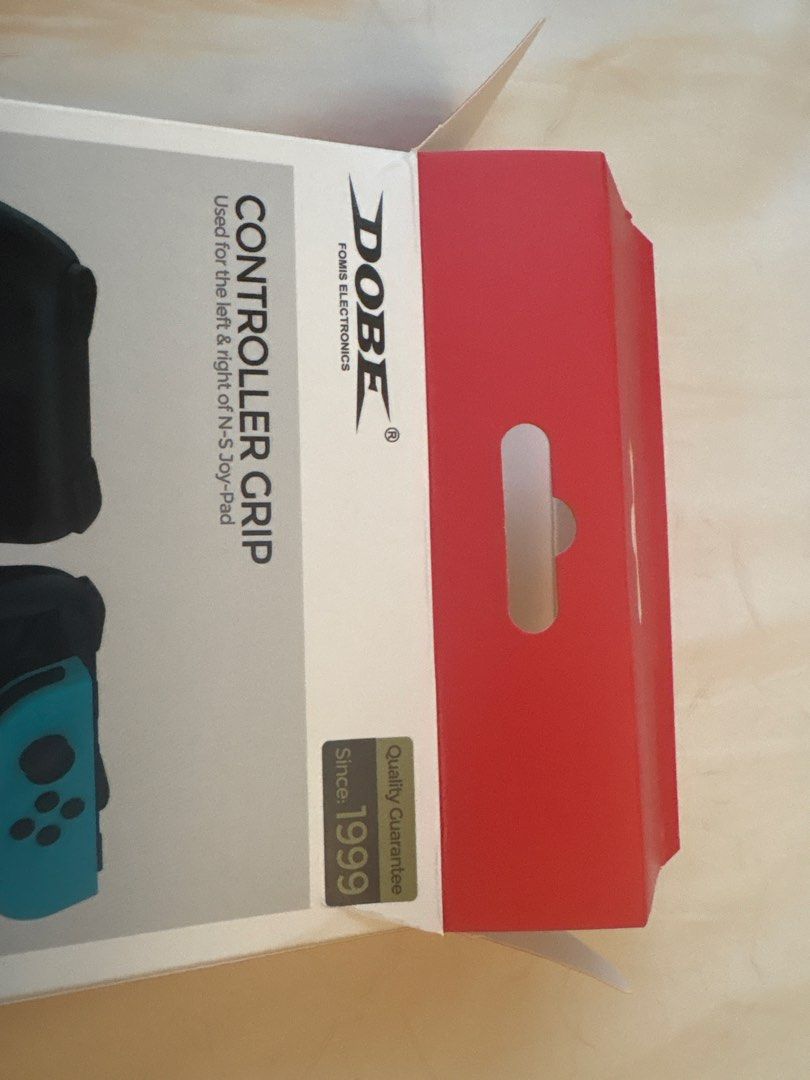 DOBE Controller Grip for Switch Oled (Category: Controllers) located in Singapore. Submitted by mosdef1 (Listing ID 1456075724, Image 3). Description: - DOBE Controller Grip for Nintendo Switch Oled - slight tear on box .