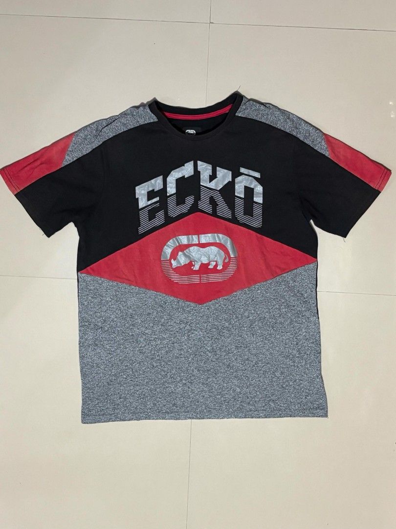 Ecko Unltd. Graphic T-Shirt (Category: Tshirts & Polo Shirts ) located in Castillejos. Submitted by fnds_wr (Listing ID 1456189318, Image 1). Description: - Brand: Ecko Unltd. - Color: Black & Grey - Size: L - Design: Classic Ecko logo graphic on front - Features: Short sleeves, crew neck - Material: Made in China - Occasion: Casual wear.
