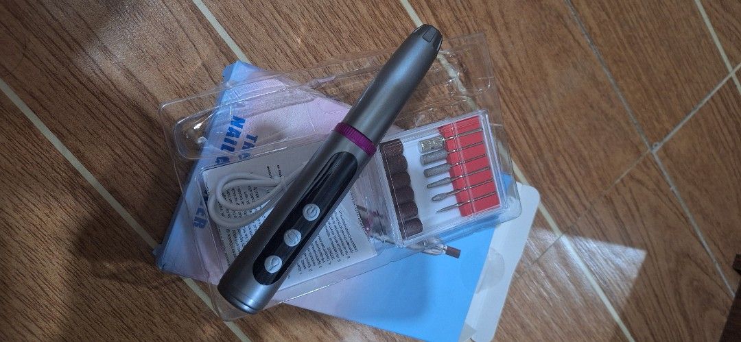 Electric Nail File Drill Set with Multiple Bits (Category: Hands & Nails) located in Quezon City. Submitted by nobledeer.dc87f4 (Listing ID 1456137306, Image 1). Description: - Portable electric nail file for convenient at-home use. - Rechargeable via USB cable. - Comes with a set of drill bits for shaping, buffing, and cuticle care. - Easy to hold and operate for a professional finish..