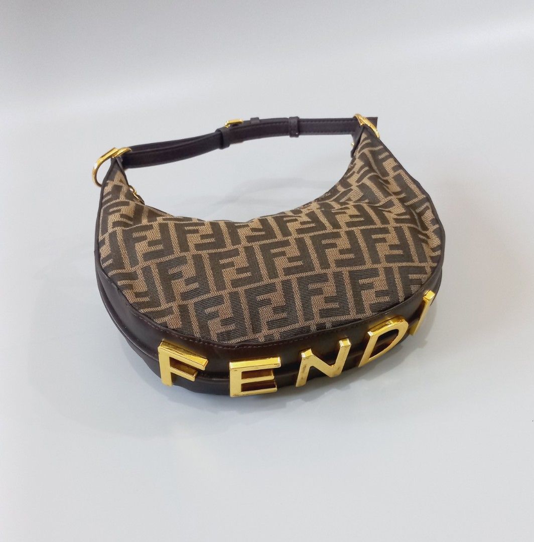 Fendi Monogram Canvas & Leather Hobo Bag (Category: Luxury Bags & Wallets) located in Cebu City. Submitted by MrLiks_123 (Listing ID 1456184553, Image 1). Description: Classic Fendi hobo bag Authenticity not guaranteed - Iconic FF monogram canvas - Brown leather trim and strap - Gold hardware with FENDI logo detail - Zipper closure - Stylish everyday bag.
