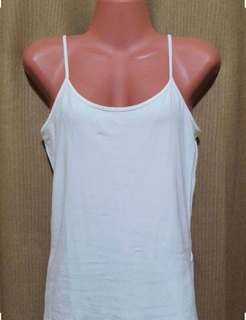 Forever 21 White Spaghetti Strap Camisole Top XL (Category: Sleeveless) located in Manila. Submitted by phoebecali (Listing ID 1456192070, Image 1). Description: - Forever 21 white camisole - Spaghetti straps - Versatile basic layering piece - Can be worn on its own or under other tops - Made in Vietnam - Size XL - Condition : used 2x only. No issues or whatsoever Taguig area 09172404648 MOP : GCASH / BDO / METROBANK / BPI .