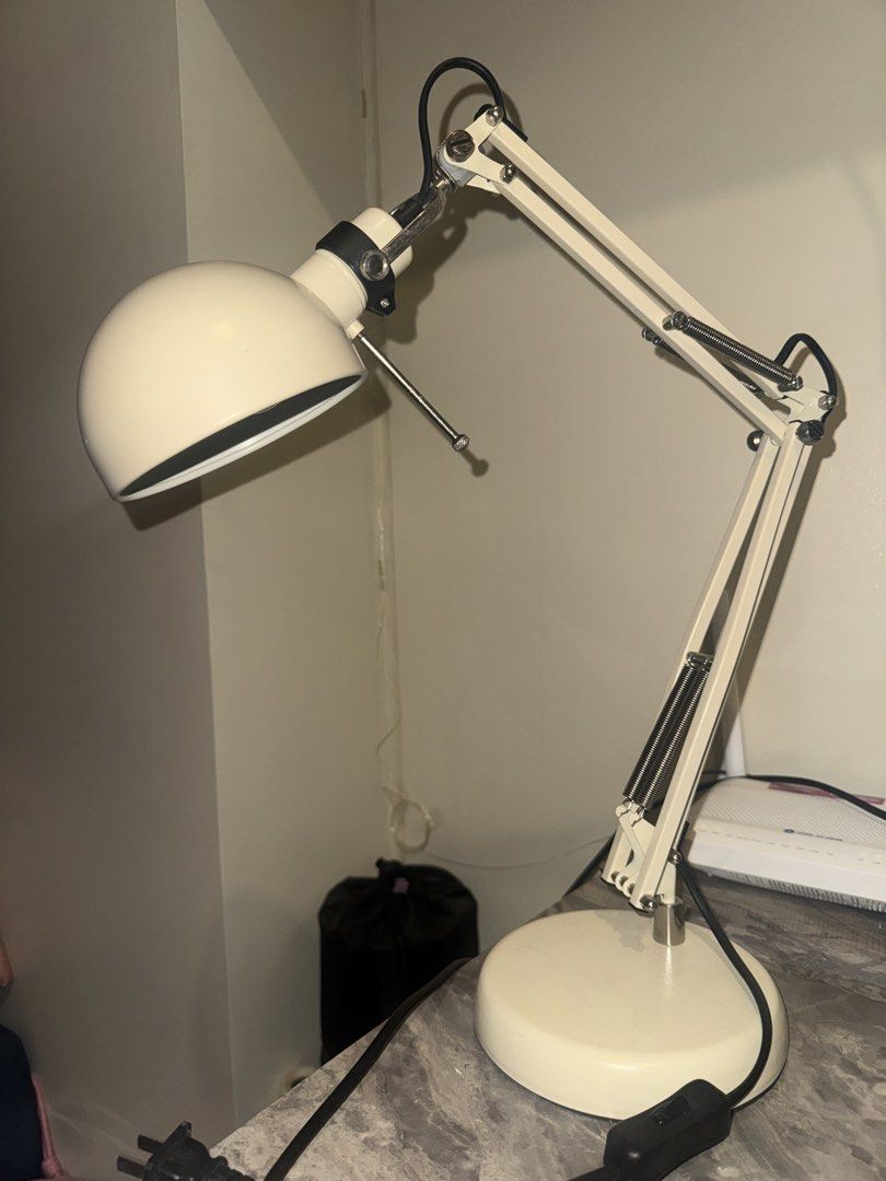 Forsa Work Lamp - Beige/Cream (Category: Lighting) located in Quezon City. Submitted by mikarchives (Listing ID 1456153517, Image 1). Description: - Beige/Cream colored adjustable desk lamp - Flexible arm and head for easy positioning - Comes with a bulb (warm light) - No issues - No box - Available for grab / lalamove delivery only.
