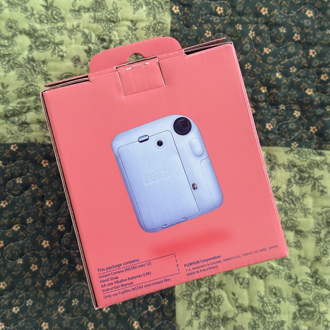 Fujifilm Instax Mini 12 + Film (Category: Cameras) located in Quezon City. Submitted by daisy00123 (Listing ID 1456076574, Image 2). Description: - Brand New Unused Fujifilm Instax Mini 12 Instant Camera - Color: Pastel Blue - Unopened Box - Includes 20 sheets of Instax Mini Film - Comes with Batteries - Includes Hand Strap - Everything you need to start taking photos immediately.