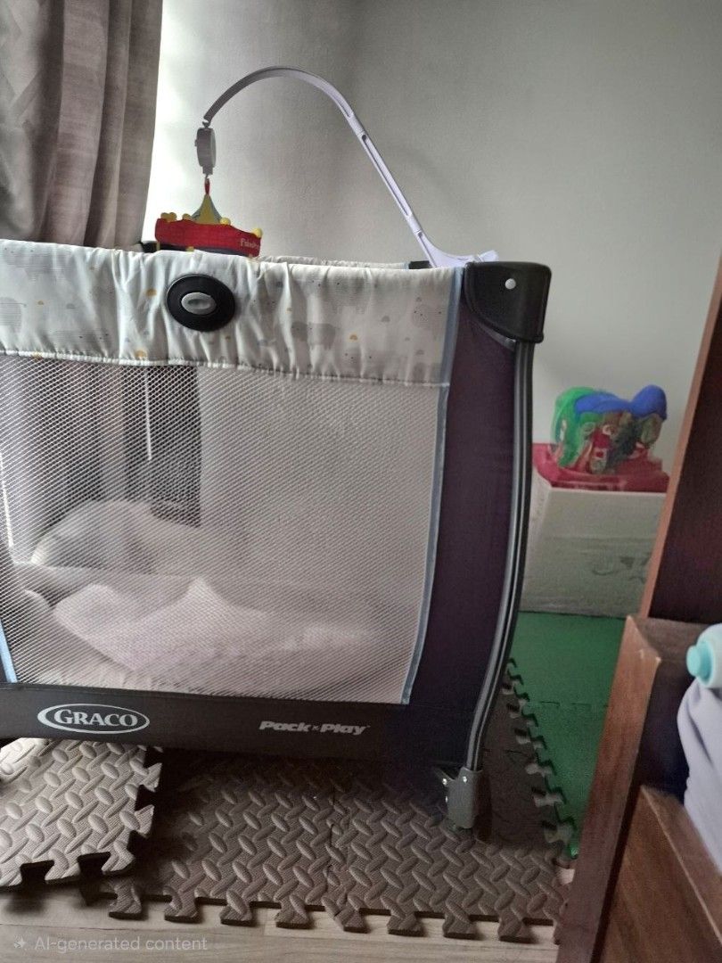 Graco Pack 'n Play Playpen with Mobile (Category: Cots & Cribs) located in Manila. Submitted by clars1821666 (Listing ID 1456097786, Image 1). Description: - Graco Pack 'n Play playpen - Includes mobile attachment - Mesh sides for visibility - Easy to set up and move - Perfect for naps and playtime.