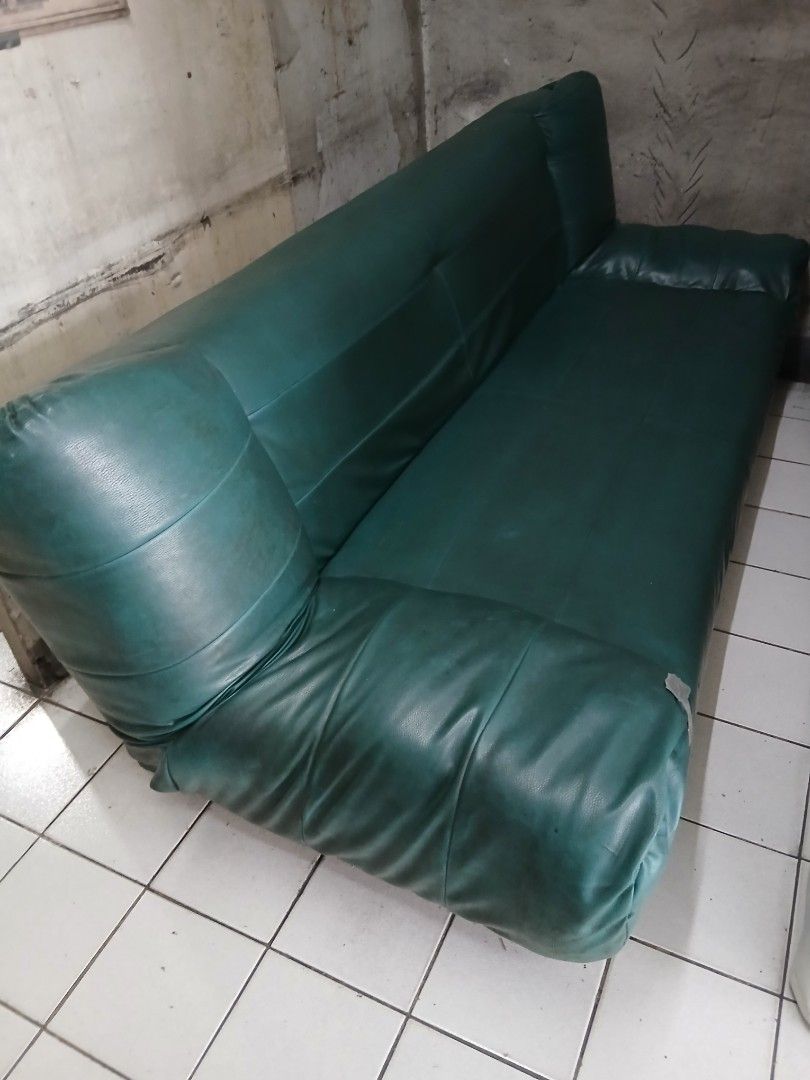 Green Faux Leather Sofa Bed with Storage (Category: Sofas) located in Dasmarinas. Submitted by tataysgarage (Listing ID 1454799362, Image 3). Description: 3-Seater Sofa Bed with 2 storage drawer. Foldable at 3 angles, Need re-upholstery and drawer repairs. Still functional as a sofa and bed. 6 ft long. Great for spare rooms ,garage, basement or student housing. Dasma Cavite Area.