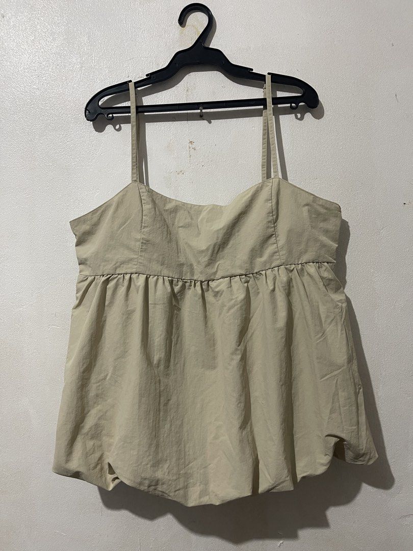 GU Beige Gathered Cut-out Camisole Top (Category: Sleeveless) located in Makati City. Submitted by vertaronda (Listing ID 1456091864, Image 1). Description: - Beige camisole top from GU - Features spaghetti straps and a gathered bust - Cute cut-out detail at the back - Gathered hem for a balloon effect - Lightweight material, perfect for warm weather - Easy to style up or down.