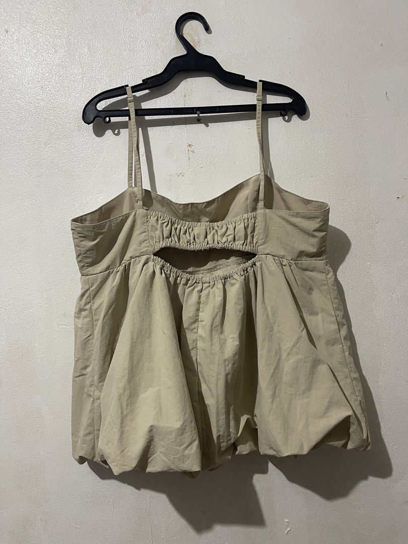GU Beige Gathered Cut-out Camisole Top (Category: Sleeveless) located in Makati City. Submitted by vertaronda (Listing ID 1456091864, Image 3). Description: - Beige camisole top from GU - Features spaghetti straps and a gathered bust - Cute cut-out detail at the back - Gathered hem for a balloon effect - Lightweight material, perfect for warm weather - Easy to style up or down.