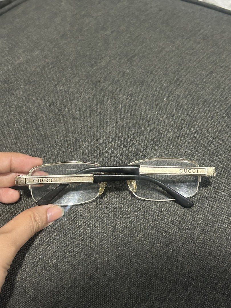 Gucci Rectangular metal-framed eyeglasses with clear lenses and black temple tips (Category: Sunglasses & Eyewear) located in General Trias. Submitted by aprilocampo0412 (Listing ID 1456190737, Image 2). Description: GucciRectangular metal-framed eyeglasses with clear lenses and black temple tips.