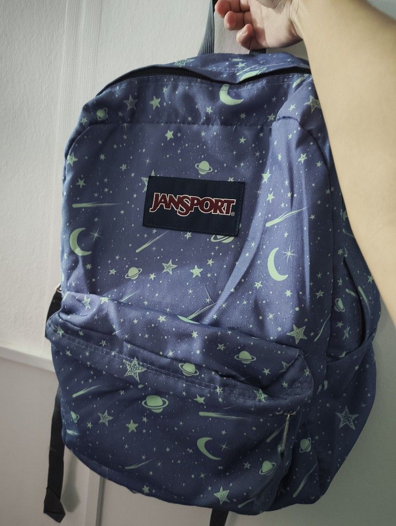 JanSport Backpack - Blue Star and Moon Print (Category: Backpacks) located in Manila. Submitted by marjdv29 (Listing ID 1456172911, Image 1). Description: - Classic JanSport backpack - Fun blue print with stars, moons, and planets - Two main compartments for ample storage - Front pocket for easy organization - Adjustable padded shoulder straps for comfort - Perfect for school or everyday adventures - Note: Shows some signs of wear on the straps a
