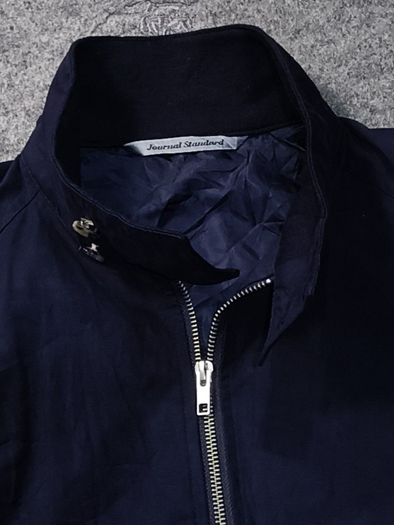 Journal Standard Navy Harrington Jacket (Category: Coats, Jackets and Outerwear) located in La Trinidad. Submitted by beenaged (Listing ID 1456114529, Image 3). Description: - Classic navy Harrington jacket by Journal Standard. - Zip-up front with button closure at the collar. - Two front pockets with button details. - Ribbed cuffs and hem for a comfortable fit. medium armpit to armpit 20.5 inches shoulder to hem 26 excellent price 880 location B