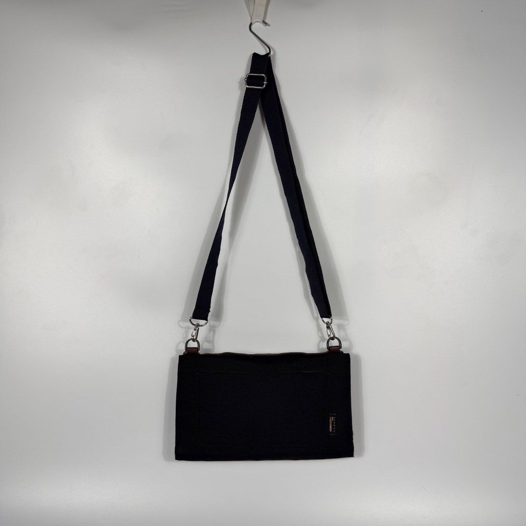 Kangol Glamping Cross Body Bag (Category: Sling Bags) located in Bacolod City. Submitted by freshstuff13 (Listing ID 1456218122, Image 2). Description: Kangol Glamping Cross Body Bag Excellent Condition Black crossbody bag with a top handle, Neat shape. Flap bag with numerous pockets and layers inside for different stuff. DM if interested 📩.