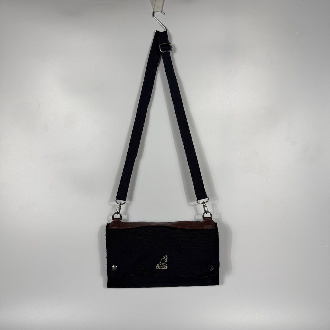Kangol Glamping Cross Body Bag (Category: Sling Bags) located in Bacolod City. Submitted by freshstuff13 (Listing ID 1456218122, Image 1). Description: Kangol Glamping Cross Body Bag Excellent Condition Black crossbody bag with a top handle, Neat shape. Flap bag with numerous pockets and layers inside for different stuff. DM if interested 📩.