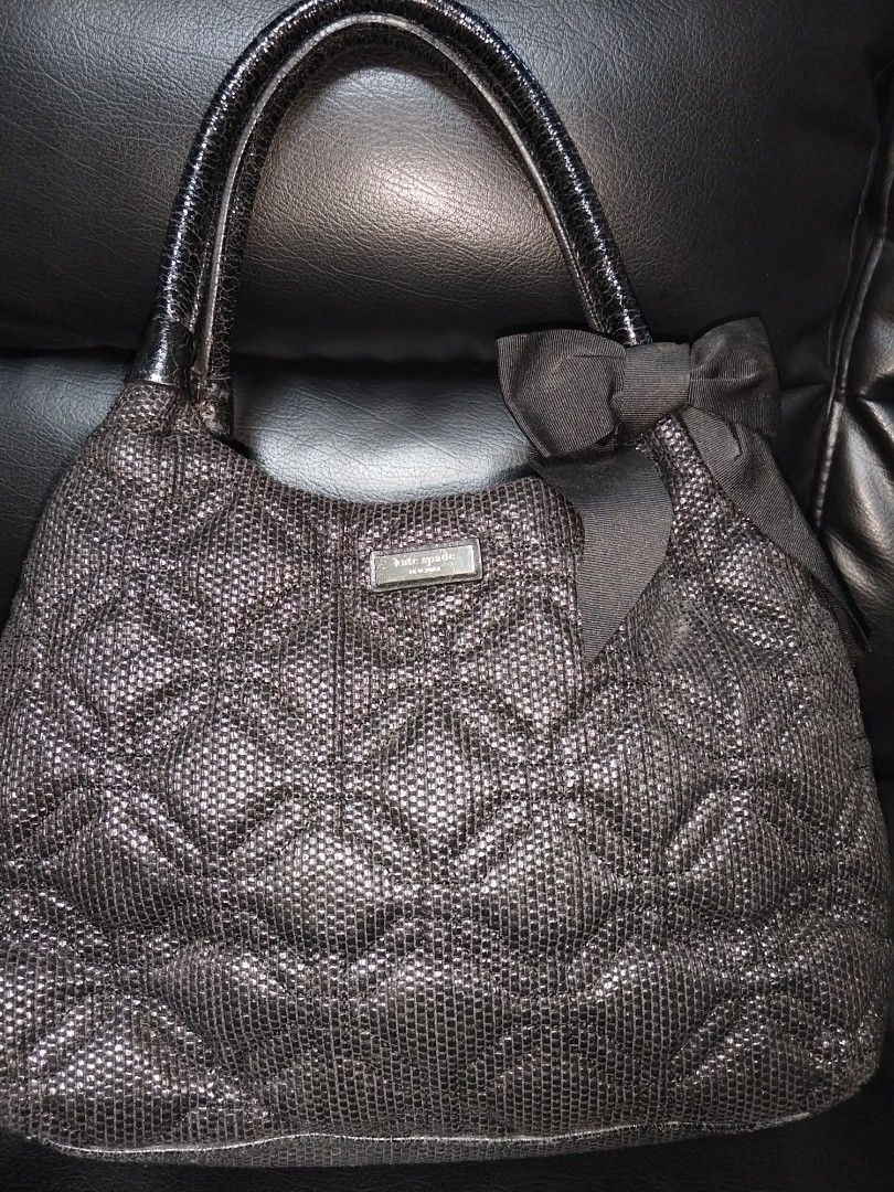 Kate Spade Quilted Hobo Bag (Category: Luxury Bags & Wallets) located in Antipolo. Submitted by gievan0725 (Listing ID 1456057801, Image 1). Description: - Black quilted Kate Spade hobo bag - Shiny textured material - Cute bow detail on the side - Patent leather handles - Polka dot interior lining - Interior zip pocket - Spacious main compartment.