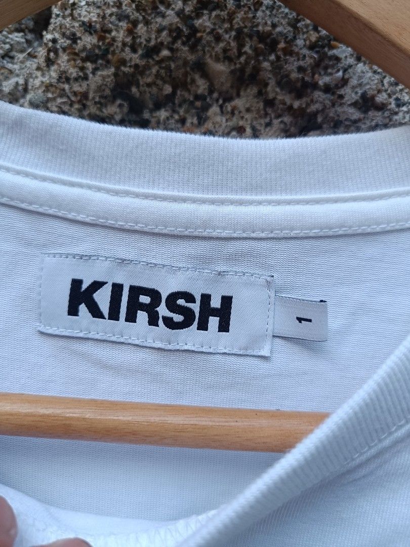Kirsh White T-shirt with Cherry Logo (Category: Tshirts & Polo Shirts ) located in Tubigon. Submitted by thrift_mac (Listing ID 1456067484, Image 3). Description: - Classic white Kirsh t-shirt - Features signature cherry logo embroidered on chest and sleeve - Made from comfortable material - Ideal for everyday casual wear - Versatile and easy to pair with any outfit - issue black stain.